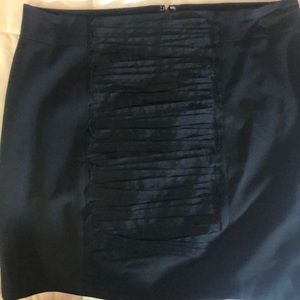 Black pencil skirt with front stitch lacing.